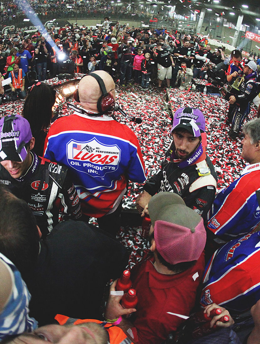 The 2016 Chili Bowl victor; Rico Abreu, soaks in the glory while Bryan Clauson and Zach Daum queue up for post-race interviews. ( Jeffrey Turford / TDP )