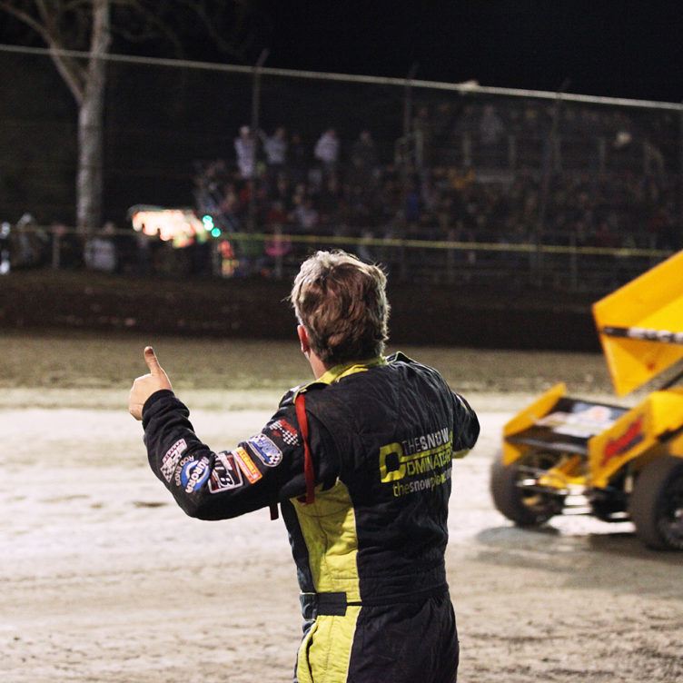 Austin McCarl gets the thumbs-up from father Terry McCarl under yellow at Volusia Speedway.( Jeffrey Turford / TDP )