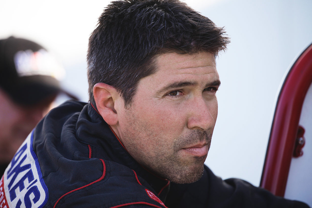 Steve Buckwalter checks the car during downtime at Selinsgrove Speedway in Pennsylvania. ( Jeffrey Turford / TDP )