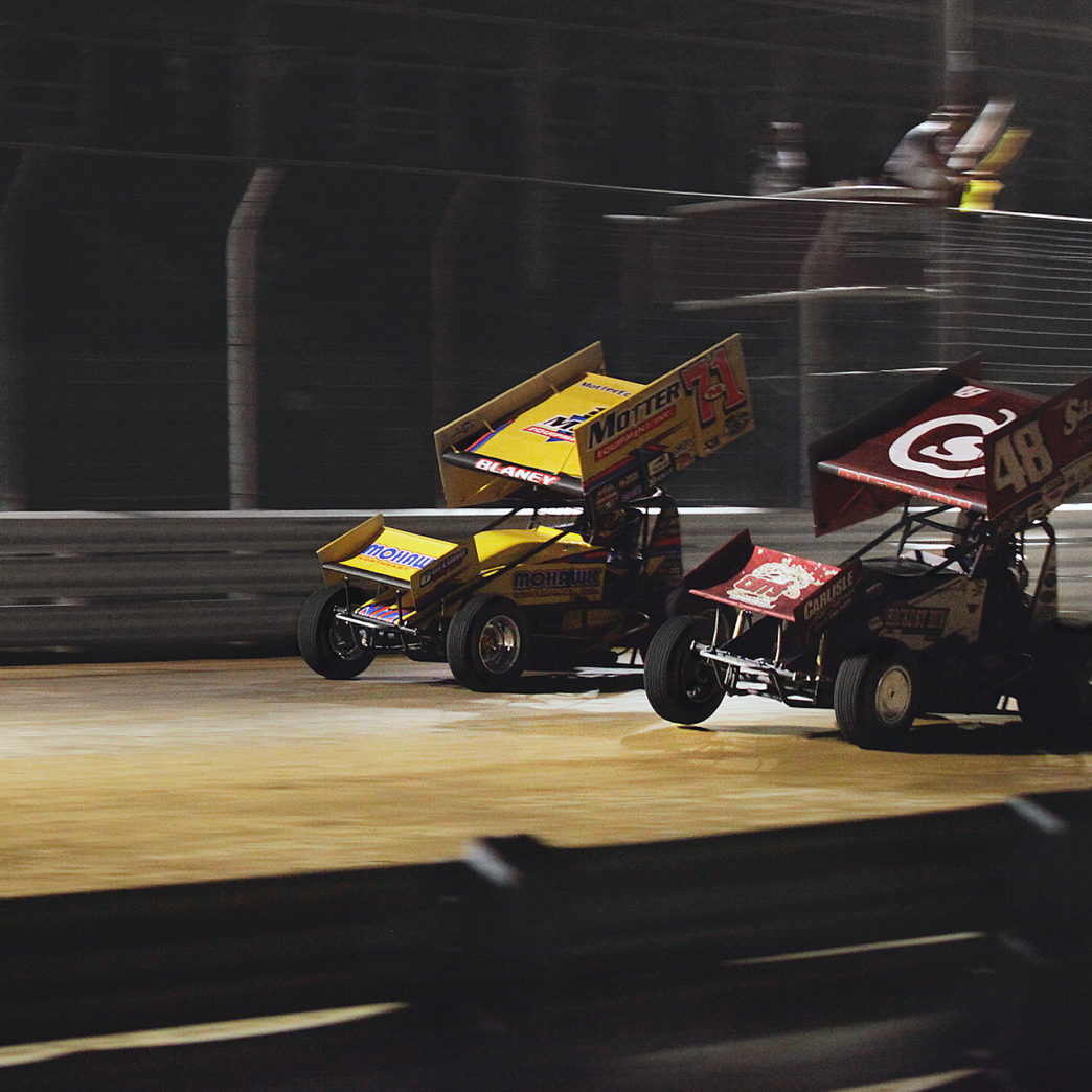 Danny Dietrich passes Dave Blaney for the lead with 1 lap to go during the Arctic Cat All Stars Circuit of Champions feature race at Selinsgrove, Pennsylvania–2016. ( Jeffrey Turford / TDP )