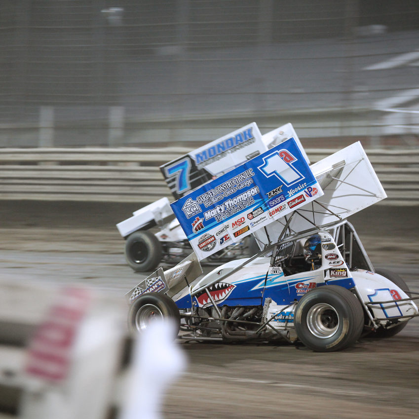Jacob Allen dives under Paul McMahan during Saturday night's feature event. Jacob Allen and Paul McMahan battling at Knoxville Speedway. McMahan would finish the feature 11th with Jacob Allen placing 13th with The World of Outlaws 410 sprints. ( Jeffrey Turford / TDP )