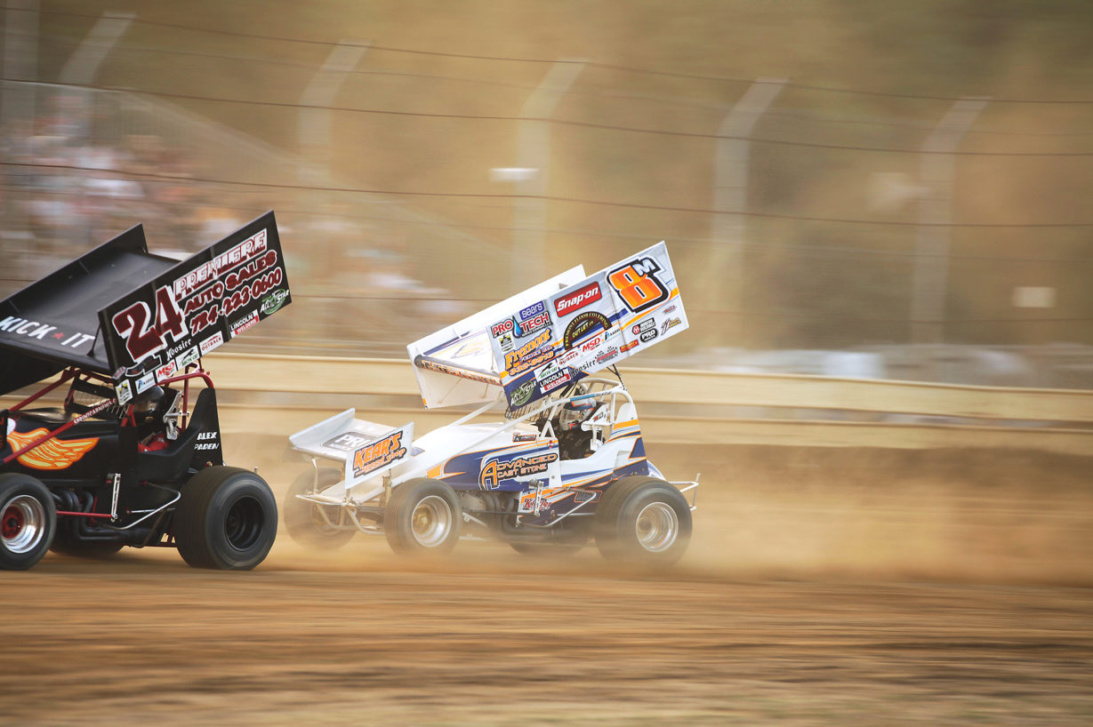 T.J. Michael makes the pass on Alex Paden in the heat race to secure the final transfer spot at Sharon Speedway with The All Star Circuit of Champions. ( Jeffrey Turford / TDP )