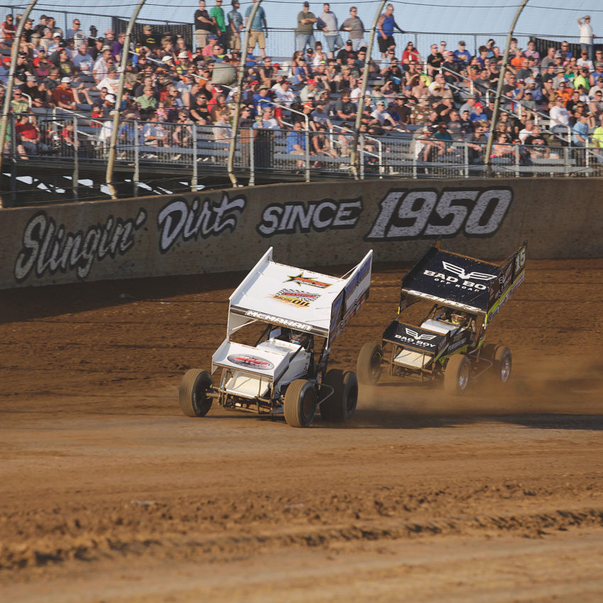 Paul McMahan and Donny Schatz battle for a transfer spot during their heat at Lawrenceburg Speedway. ( Jeffrey Turford / TDP )
