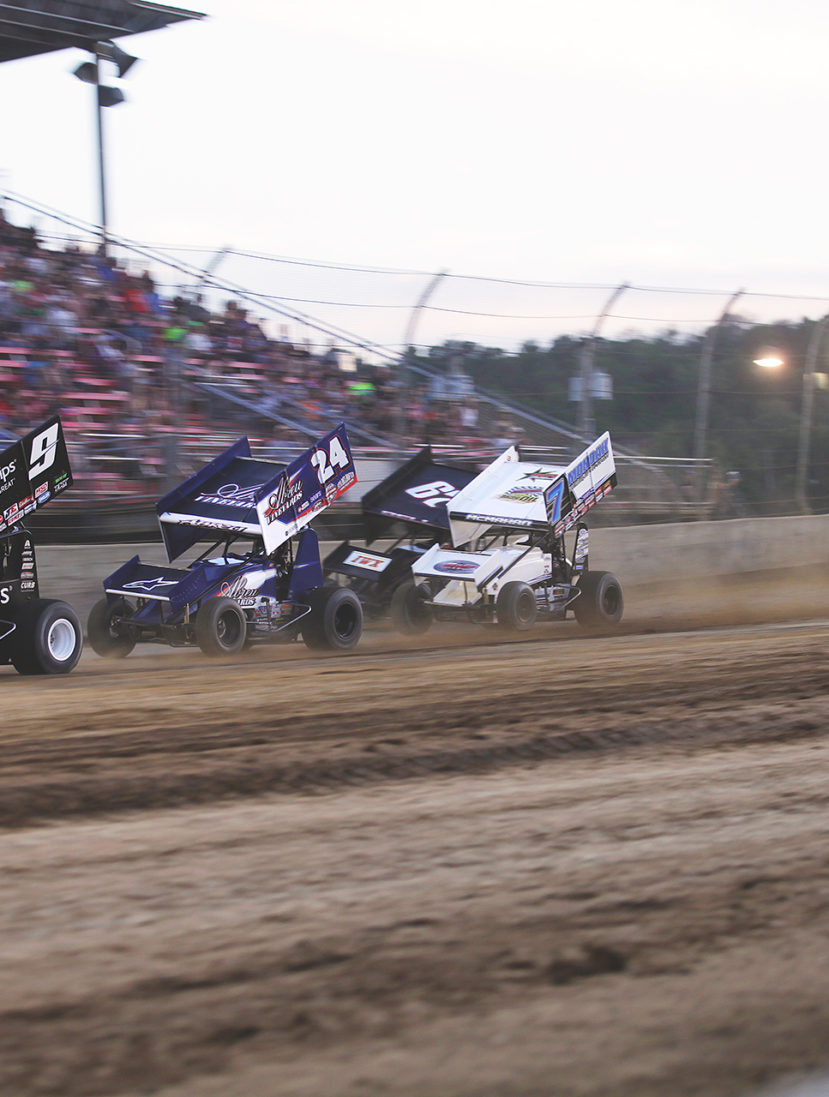 Daryn Pittman leads a stacked field of Rico Abreu, Christopher Bell, Paul McMahan, Kyle Larson, Shane Stewart and David Gravel and Joey Saldana in to the first turn in the dash race at Lawrenceburg Speedway, IN. ( Jeffrey Turford / TDP )