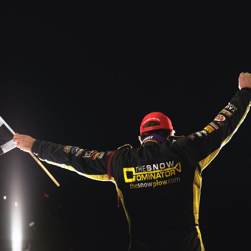 Terry McCarl celebrates his victory on Friday night. McCarl started 1st and finished 1st during the World of Outlaws feature on Friday night at Knoxville Raceway. ( Jeffrey Turford / TDP )