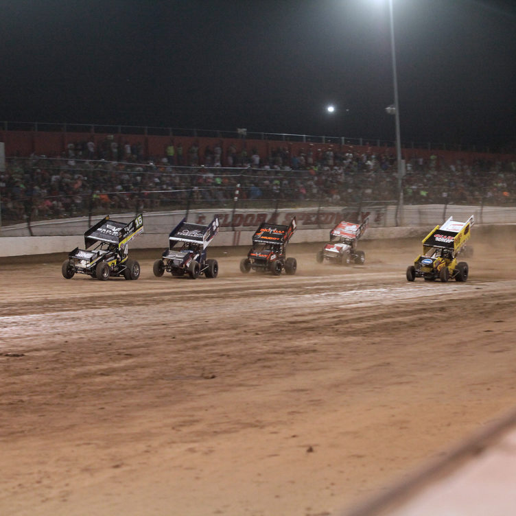 Donny Schatz leading the field into turn 1 at the last restart before the checkered. ( Jeffrey Turford / TDP )