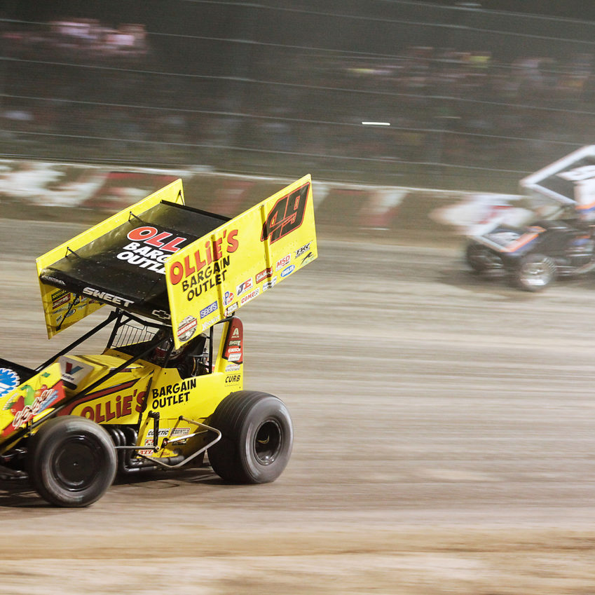 Brad Sweet overtakes Sheldon Haudenschild on the low-side through turn 1. Sweet secured the Hard Charger Award, going from 20th to 12th, the Knight Before The Kings Royal. ( Jeffrey Turford / TDP )