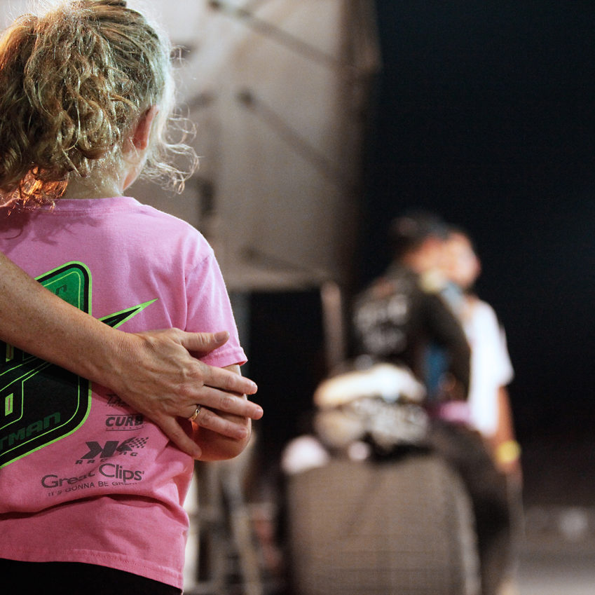 Daryn Pittman's family looks on as Daryn Pittman does the post-race interview having just won the feature on The Knight Before The Kings Royal. ( Jeffrey Turford / TDP )
