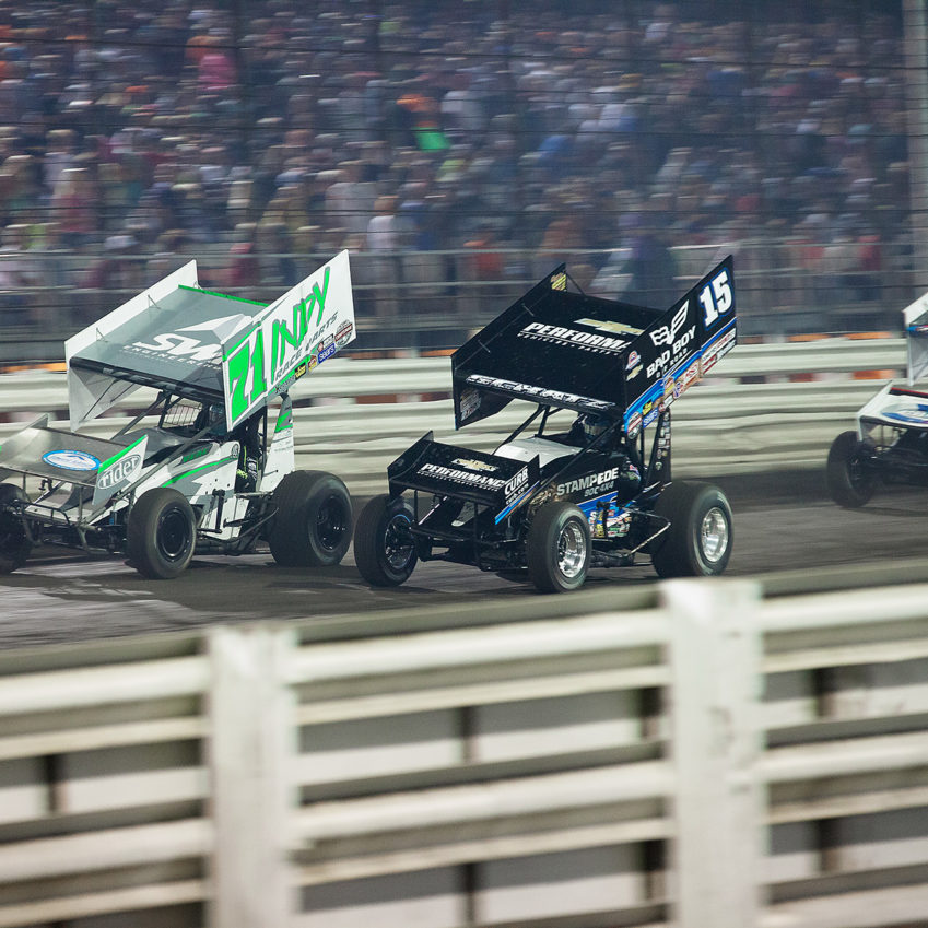 Donny Schatz passing Jamie Veal on the fronstretch at The 2016 Knoxville Nationals. ( Jeffrey Turford / TDP )