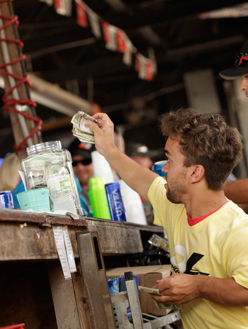 Rico Abreu, Kyle Larson and unpictured, Brad Sweet running the bar at legendary bar, Dingus. Proceeds from the bar going to the family of Bryan Clauson. ( Jeffrey Turford / TDP )