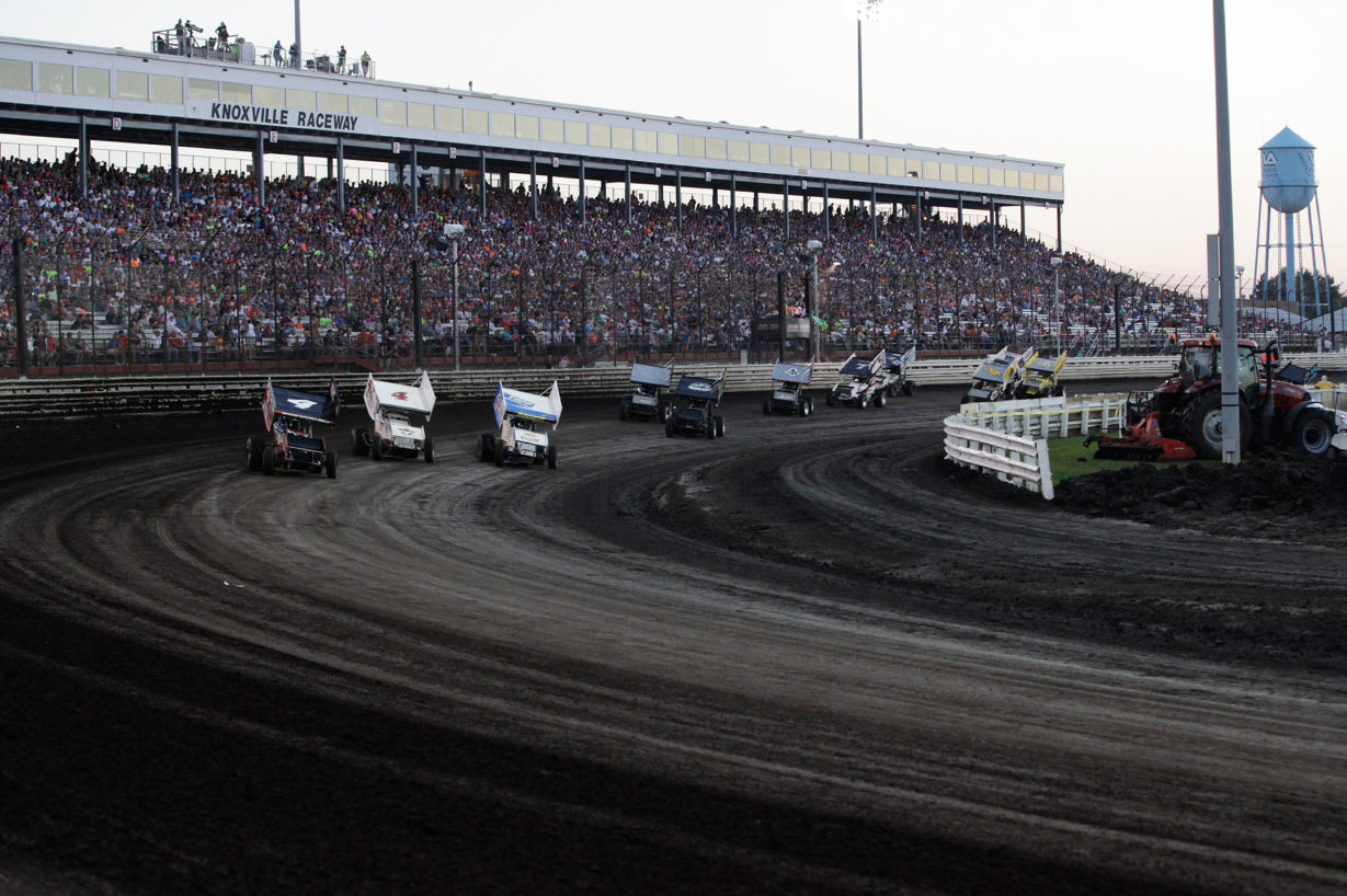 Left to right, No. 4 Jon Agan, No. 4S Danny Smith and 23C Tyler Courtney go 3 wide into turn 1 in the E Main on the final night of The Knoxville Nationals. ( Jeffrey Turford / TDP )