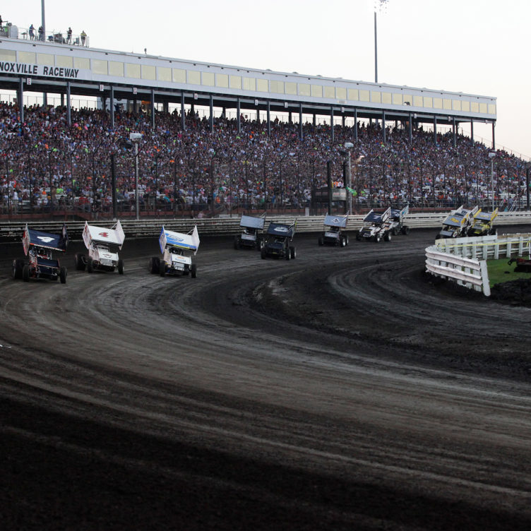 Left to right, No. 4 Jon Agan, No. 4S Danny Smith and 23C Tyler Courtney go 3 wide into turn 1 in the E Main on the final night of The Knoxville Nationals. ( Jeffrey Turford / TDP )