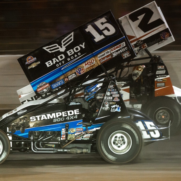 Donny Schatz passing Shane Stewart on the backstretch at The Dirt Track at Charlotte during the WoO World Finals Friday night Feature. Donny Schatz started 15th and made his way to 3rd place, picking up the Hard Charger award during the Friday night Feature at The 2016 WoO World Finals in Charlotte, NC.( Jeffrey Turford / TDP )