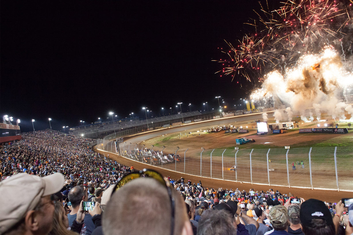 Fireworks light-up the 19 car field, in anticipation for the green, during the Feature race Saturday night, Day 2 of The Bad Boy Off Road World of Outlaws World Finals at The Dirt Track at Charlotte, in North Carolina 2016. ( Jeffrey Turford / TDP )