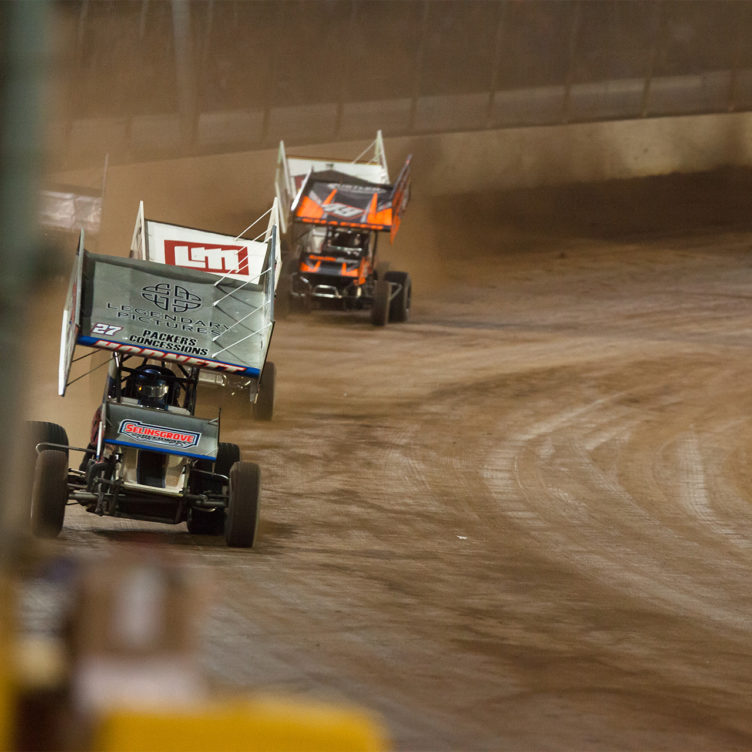 No. 27 Greg Hodnett chases down leader No. 5 David Gravel on the backstretch at The Dirt Track at Charlotte in 2016. ( Jeffrey Turford / TDP )