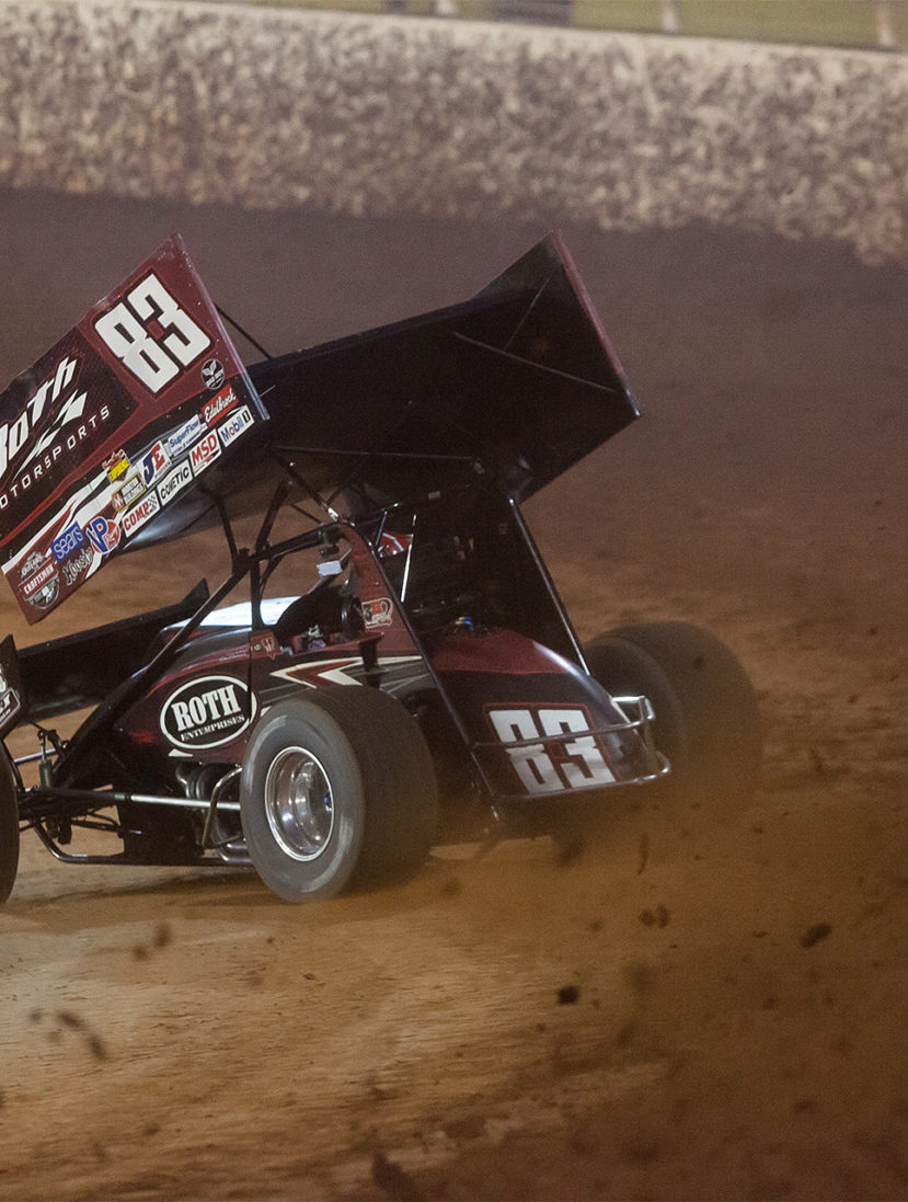 No. 83 Joey Saldana on the gas through turns 3 and 4 in Heat 2 on the final night of the 2016 WoO World Finals at The Dirt Track at Charlotte. Saldana placed 2nd in his heat to collect a transfer spot to the Feature at The 2016 World of Outlaws World Finals in North Carolina. ( Jeffrey Turford / TDP )