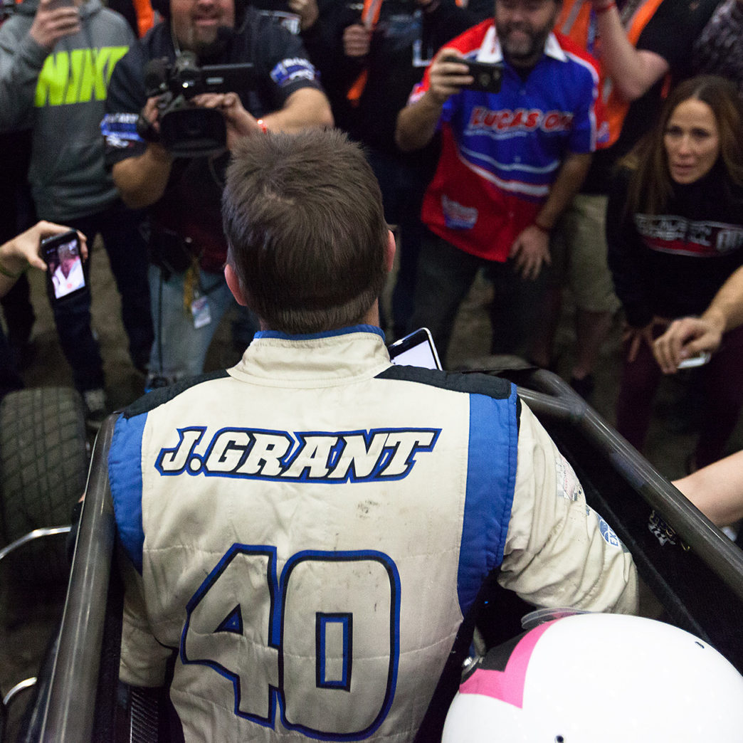 Friday January 13, 2017 TULSA, Oklahoma - Friday January 13, 2017 TULSA, Oklahoma - No. 39bc, Justin Grant shares his victory with wife and twin newborns, over a cellphone on Vacuworx Qualifying Night, of The 31st annual Lucas Oil Chili Bowl Nationals presented by General Tire ( Jeffrey Turford / TDP )