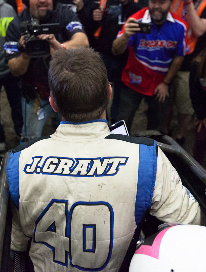 Friday January 13, 2017 TULSA, Oklahoma - Friday January 13, 2017 TULSA, Oklahoma - No. 39bc, Justin Grant shares his victory with wife and twin newborns, over a cellphone on Vacuworx Qualifying Night, of The 31st annual Lucas Oil Chili Bowl Nationals presented by General Tire ( Jeffrey Turford / TDP )