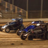 Brenham Crouch in the 97 gets speed out of turn 4 to overtake Chance Crum and no. 15 Emerson Axsom. Brenham Crouch would go on to win the A Feature at the 2021 Lake Ozark Speedway Memorial Weekend Sprint and Midget Nationals. ( Jeffrey Turford / TDP )