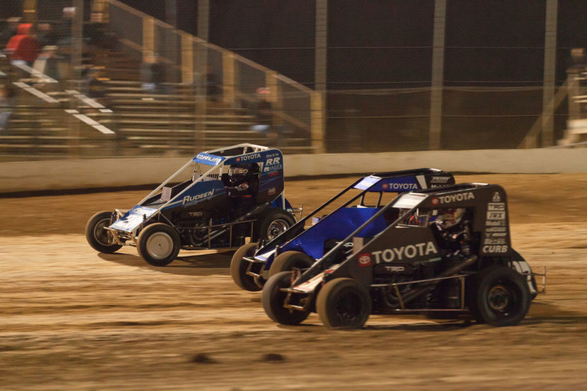 Brenham Crouch in the 97 gets speed out of turn 4 to overtake Chance Crum and no. 15 Emerson Axsom. Brenham Crouch would go on to win the A Feature at the 2021 Lake Ozark Speedway Memorial Weekend Sprint and Midget Nationals. ( Jeffrey Turford / TDP )