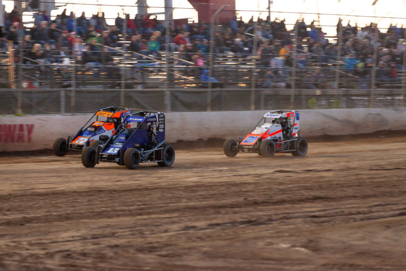 No 15 Emerson Axsom is chased by 72 Sam Johnson and 21K Karter Sarff for 2nd during the heat races on night 1 of the Lake Ozark Speedway Memorial Weekend Sprint and Midget Nationals. ( Jeffrey Turford / TDP )