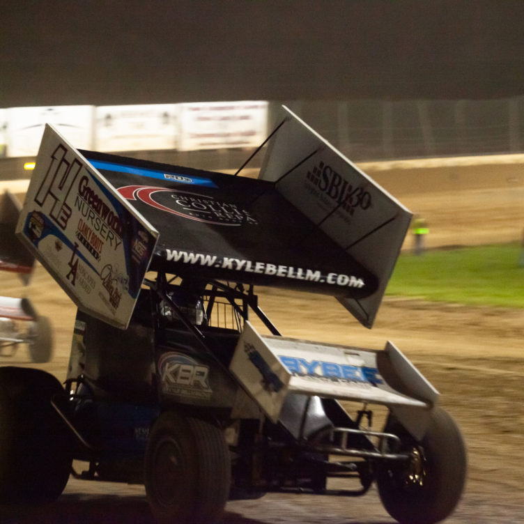 The 14E of Kyle Bellm chased by Landon Crawley down the front stretch at Lake Ozark Speedway during the heats at the 2021 Memorial Weekend Sprint and Midget Nationals presented by The Drivers Project. ( Jeffrey Turford / TDP )