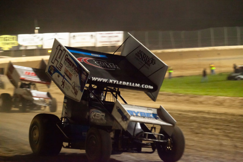 The 14E of Kyle Bellm chased by Landon Crawley down the front stretch at Lake Ozark Speedway during the heats at the 2021 Memorial Weekend Sprint and Midget Nationals presented by The Drivers Project. ( Jeffrey Turford / TDP )