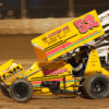 The 52 of Blake Hahn goes low through turn 2 and overtakes the 28 of Scott Bogucki during their heat race at Lake Ozark Speedway for the 2021 Memorial Weekend Sprint and Midget Nationals presented by The Drivers Project. ( Jeffrey Turford / TDP )