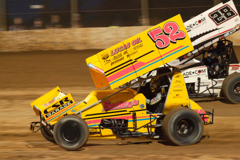 The 52 of Blake Hahn goes low through turn 2 and overtakes the 28 of Scott Bogucki during their heat race at Lake Ozark Speedway for the 2021 Memorial Weekend Sprint and Midget Nationals presented by The Drivers Project. ( Jeffrey Turford / TDP )